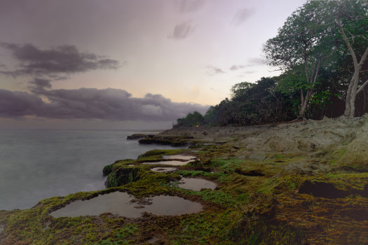 Mystical Seaside: Enchanting Acrylic Print of Mossy Rocks and a Sunset Shrouded in Sea Mist