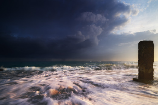"Oceanic Dawn": Acrylic prints wall art for office or home, featuring sunrise, thunder clouds, and mysterious ocean pillar.