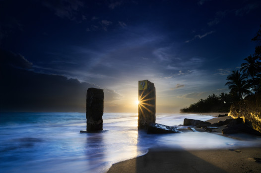 Sunset Serenade: Ocean's Mysterious Pillars & Ominous Cloud