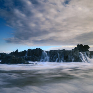 Seascape Symphony: An Acrylic Print Celebrating the Mystical Meeting of Dawn, Ocean Waves, and Rocks